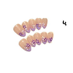 Violet French almond press-on nails with floral patterns and subtle glitter shimmer