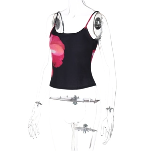 Detail of a slim-fit crop top featuring pink floral print on black fabric with thin straps