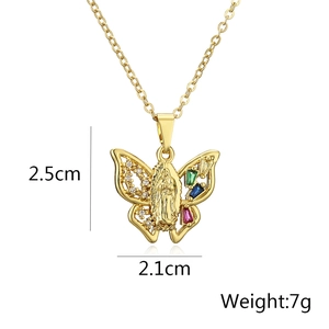 Close-up of butterfly pendant with Maria figure and colorful gemstone settings
