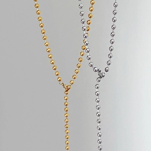 Minimalist gold and silver beaded Y-shaped long necklace with polished metallic finish