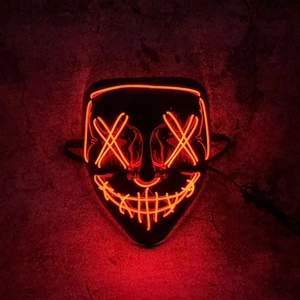 Halloween LED glowing mask in red orange with Purge style neon lights on dark background