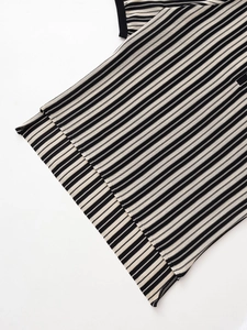 Close-up of black and white striped knit texture and high-quality fabric stitching detail