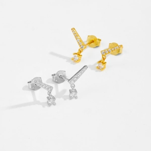 Macro shot of S925 sterling silver stud earrings with high clarity zircon in gold and silver