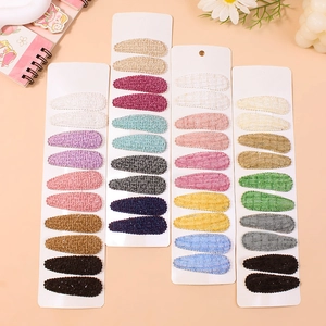 Floral embroidery snap hair clips for girls in various colors on paper card display
