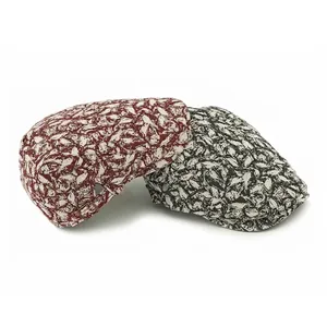 Vintage ivy caps with abstract leaf prints in red and black featuring adjustable buckles
