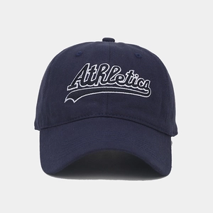 Close-up of Athletics embroidery on navy blue cotton baseball cap with classic 6-panel crown