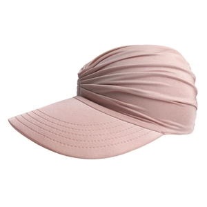 Detailed side view of pink sun visor hat with elastic pleated fabric and wide brim