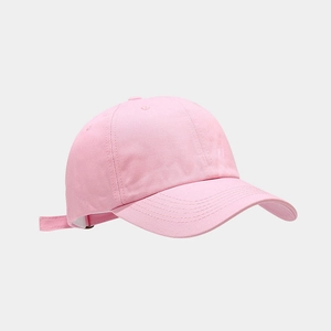 Detail view of pink cotton baseball cap with six-panel design and adjustable strap