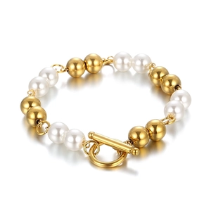 Elegant 18k gold plated bead and pearl toggle clasp bracelet on white background