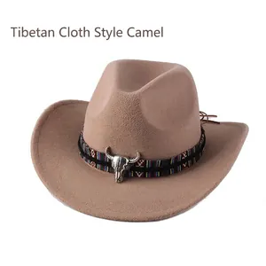 Detail of camel wool cowboy hat featuring ethnic woven band and silver bull skull charm