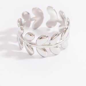 Detailed view of silver stainless steel leaf ring with olive branch design on white background
