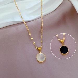 Double-sided titanium steel necklace featuring white shell and black round pendant details