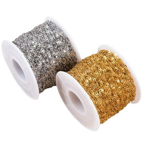Gold and silver stainless steel figure-8 flash chains on white plastic spools for DIY jewelry
