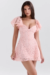 Detailed view of pink floral lace texture and ruffled cuff design on the V-neck dress