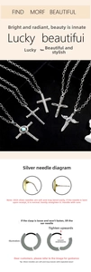 Detailed macro view of S925 silver cross pendants with blue stone and wing engravings