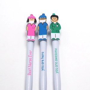 Detailed view of three white ballpoint pens with cartoon doctor and nurse tops and quotes
