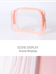 Detail view of orange translucent PVC makeup bag with waterproof zipper and sleek design