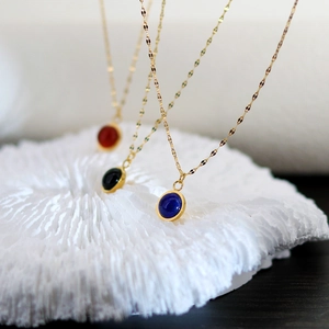 Three minimalist agate stone pendant necklaces in blue, green and red with 18K gold finish