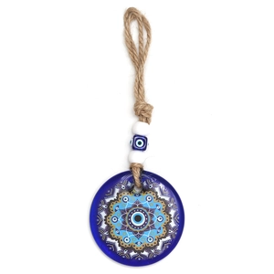 Detailed macro view of Evil Eye charm with mandala pattern on a rustic hemp rope cord