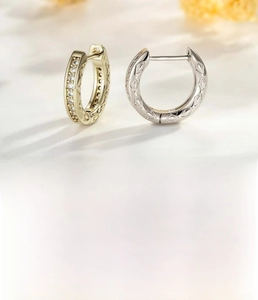Detail of coffee gold and silver ear cuffs with 10mm inner diameter and zircon stones