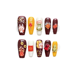 Handmade Year of the Dragon press-on nails in burgundy red with gold charms and 10 pieces