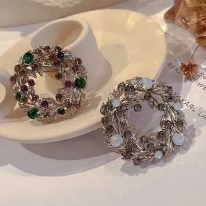 Detailed macro view of vintage baroque flower brooches with micro-inlaid rhinestones