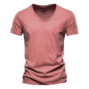 Detail showing high-quality slub cotton fabric texture and V-neck of a red men's T-shirt