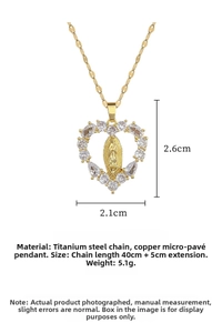 Macro shot of gold Virgin Mary heart pendant with shimmering crystals on titanium chain