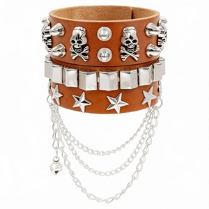 Detail of punk wide leather bracelet with silver skull, metal rivets and layered chains