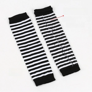 Detail showing the inner layer and front side of black and white striped arm warmers
