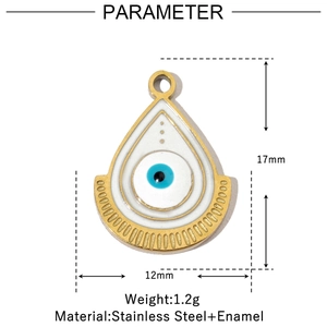 Macro view of teardrop enamel charm with blue eye detail and gold stainless steel frame