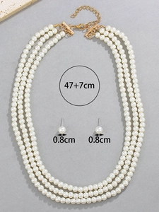 Detailed view of multilayer pearl necklace set with 47+7cm chain and 0.8cm earrings