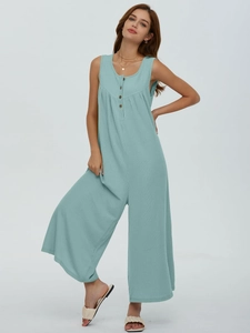 Detail of mint blue ribbed knit fabric on sleeveless jumpsuit with front buttons