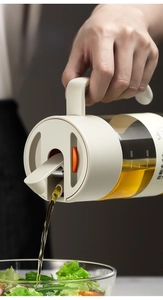 Action shot of 550ml glass oil dispenser pouring dressing with gravity lid