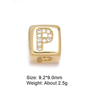 Macro detail of gold 8mm letter P charm bead with zircon inlay and product dimensions