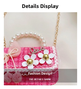 Detail of pink tweed bag with pearl handle, rhinestone Love logo and floral bow