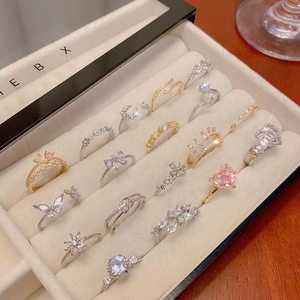 Collection of zircon rings with heart, butterfly and crown motifs in gold and silver