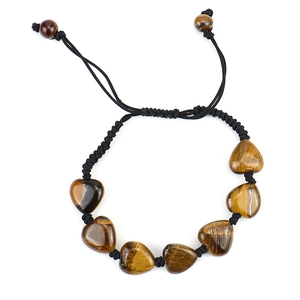 Detailed view of hand-woven bracelet with heart-shaped tiger eye stones and adjustable cord