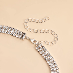 Detail of lobster clasp and adjustable silver extension chain with triple-row rhinestones