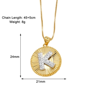Detail view of 18k gold plated letter K necklace pendant with micro-inlaid rhinestones