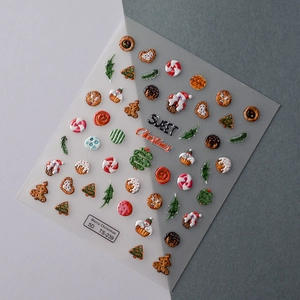 Detail of 5D embossed Christmas nail stickers featuring Santa and gingerbread man