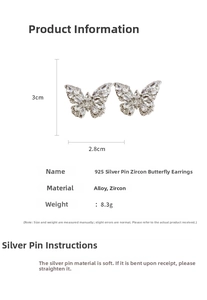 Detail view of butterfly zircon earrings showing dimensions 3cm by 2.8cm and 8.3g weight