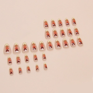 Almond-shaped press-on nails set featuring gradient autumn heart patterns in nude pink