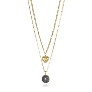 Detail of 18K gold-plated double-layer necklace with heart and star round pendants