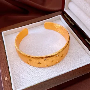 18k gold plated cuff bracelet with star zircons and brushed matte texture in a gift box