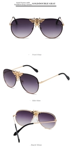 Detail of aviator sunglasses with gold bee emblem on bridge and gradient purple lenses