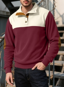 Detail showing ribbed knit fabric with brown elbow patches on a colorblock polo shirt