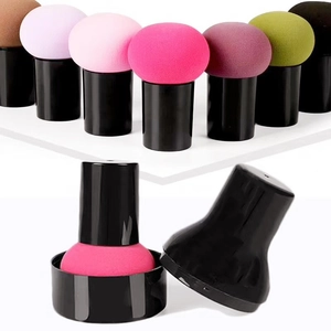 Detail of mushroom head makeup sponge sets with handles and black storage cases