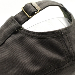 Rear view of adjustable cotton cap featuring a vintage metal buckle and twill fabric