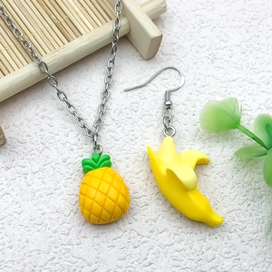 Cute resin fruit jewelry set featuring pineapple pendant necklace and banana earrings